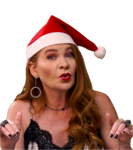 Imagem decorativa da Cátia Damasceno com um gorro natalino e expressão espontânea, pega de surpresa